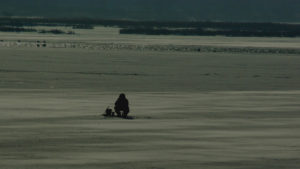icefishing on manistee county lake - one person