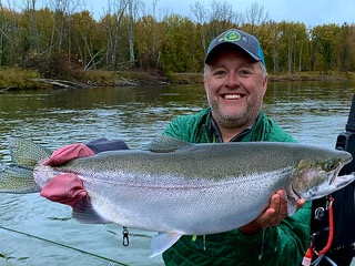 River Little Manistee MI USA young fisherman with fly fishing