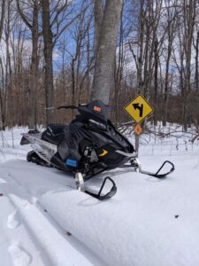 Snowmobile on trail