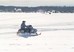 snowmobiling across lake