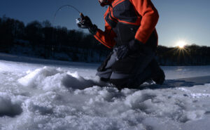 Ice fisherman on lake