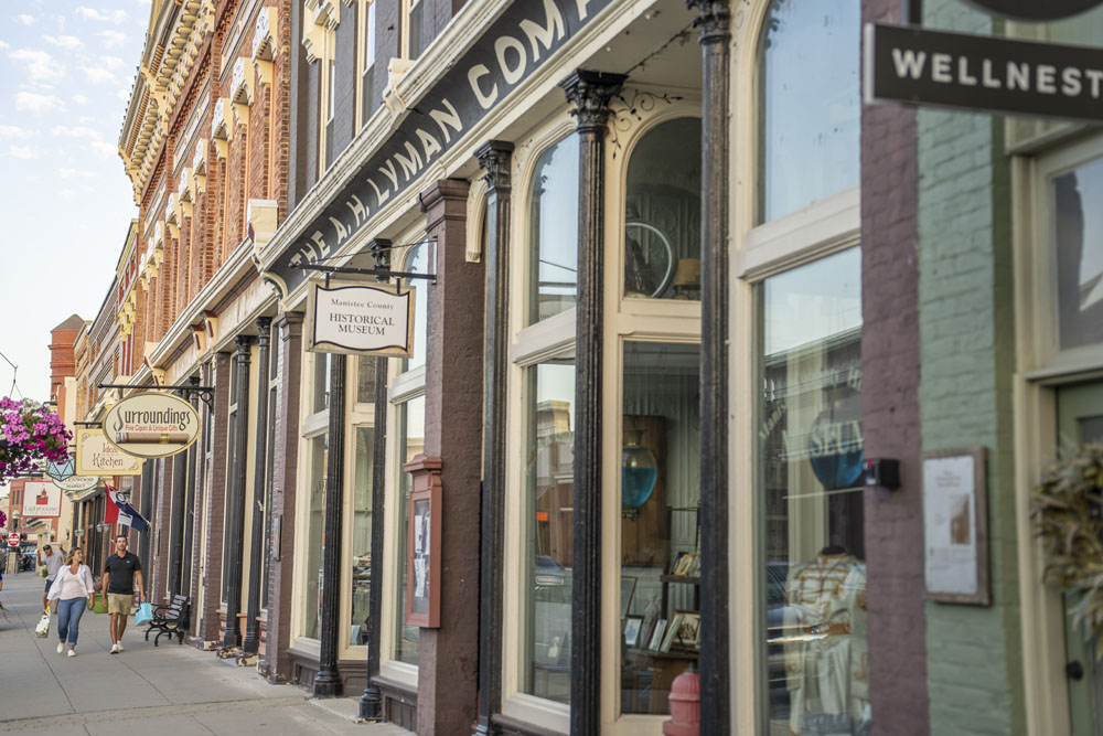 Strolling and shopping downtown Manistee, Michigan. Downtown store fronts