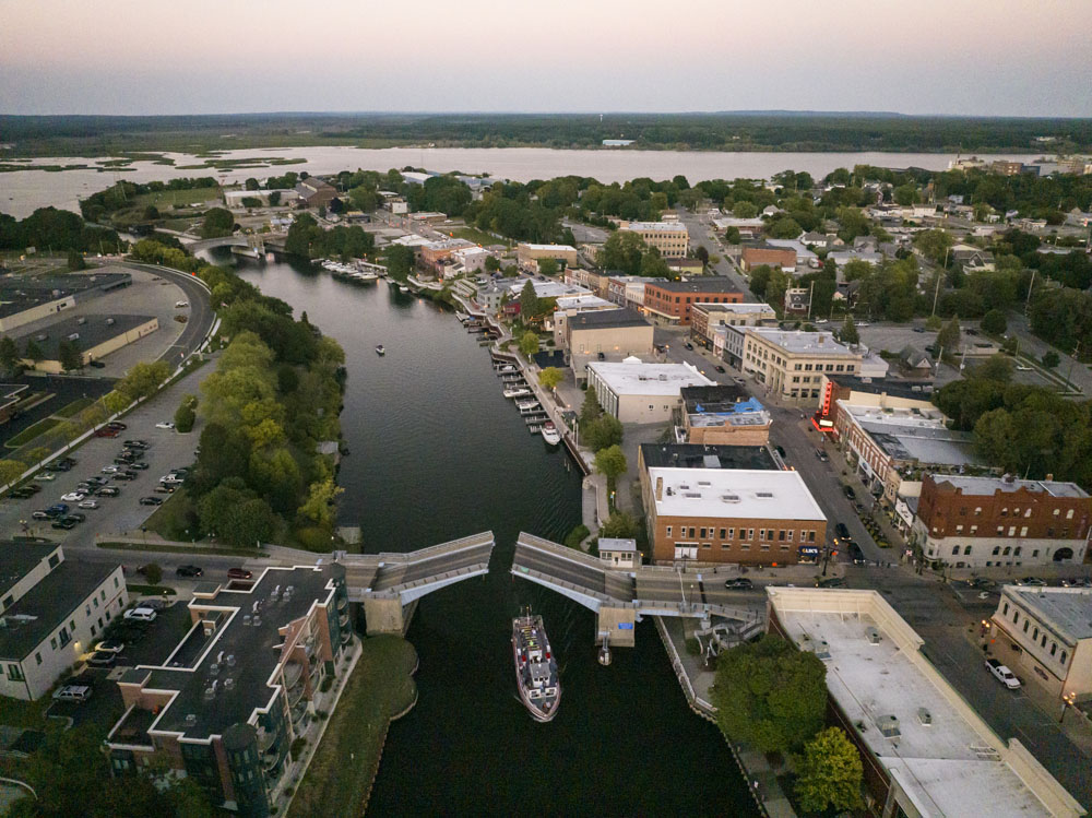 Aerial view of sunset over the Manistee River in Manistee, Michigan. Aerial view of Downtown Manistee
