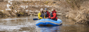 People paddling the Pine River in winter